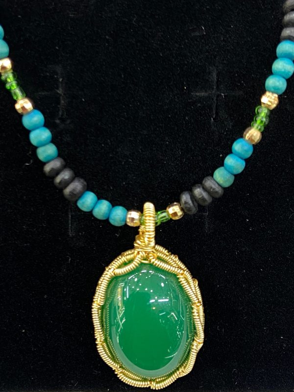 Handcrafted African Beaded Necklace with Green Gemstone Pendant